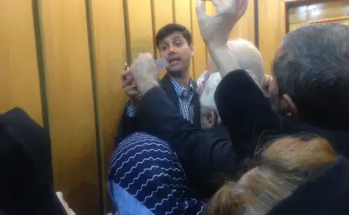 Parliamentary candidate Sayed Miaad Salehi is mobbed by supporters. Image courtesy of Reese Erlich. Iran, 2020.