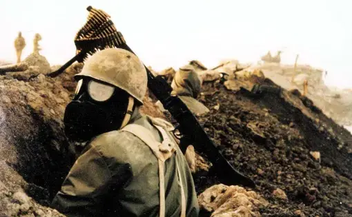 An Iranian soldier wearing a gas mask during the Iran-Iraq War. In the waning days of the war, Iraq resorted more frequently to bombarding soldiers and civilians with sulfur mustard and nerve agents. Image licensed under CC BY-SA 3.0.