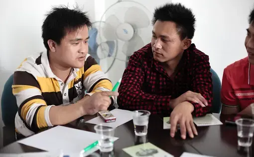 Migrant workers attend a safety training session at China Labor Watch on  February 27, 2011 in Shenzhen, Guangdong Province. The majority of participants in this session had sustained serious hand injuries at work. Image by Jocelyn Baun. China, 2011.
