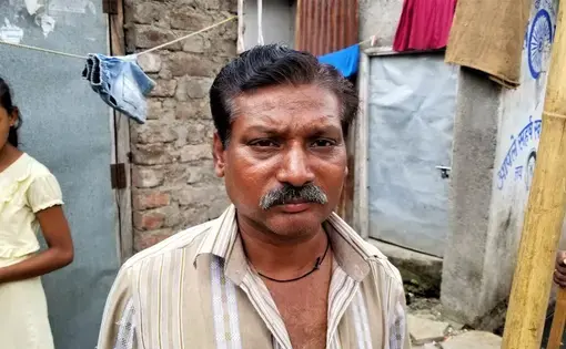 Dalit sewage cleaner, who is on the lowest rungs of so-called "untouchables." Image by Phillip Martin/WGBH News. India, 2019. Dalit sewage cleaner, who is on the lowest rungs of so-called "untouchables." Image by Phillip Martin/WGBH News. India, 2019.