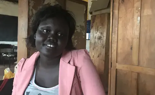 Jessica Deng, 21, was born and raised in Kakuma. Now she teaches math at Bhar-El-Naam. Image by Jaime Joyce. Kenya, 2018. Jessica Deng, 21, was born and raised in Kakuma. Now she teaches math at Bhar-El-Naam. Image by Jaime Joyce. Kenya, 2018.