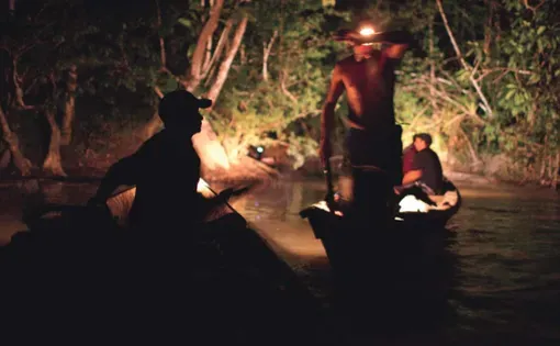 Garimpeiros bring diesel, food, engine parts, and other goods up the Sikini Creek to be distributed to illegal gold mines throughout French Guiana. Photo by Narayan Mahon, French Guiana, 2010.