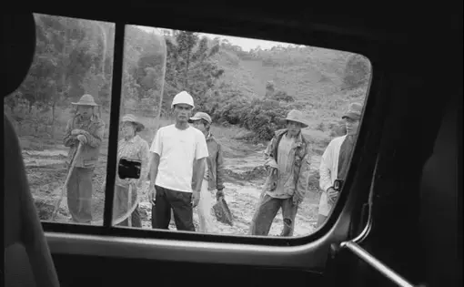 An engineer and Burmese laborers on the gas and oil pipeline that carves its way from Kunming in China to the Indian Ocean on the coast of Burma. Built and designed by the China National Petroleum Corporation, the pipeline will be 2,800 km long once complete. Image by Gary Knight. Burma, 2012. Media file: gmk_bur__071.jpg