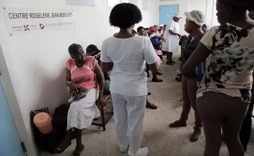 A nurse at the University Hospital of Mirebalais in central Haiti calls out the names of patients who will be getting their chemotherapy treatment. Image by José A. Iglesias. Haiti, 2018.