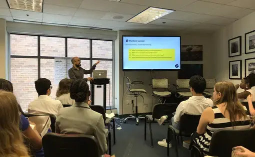Pulitzer Center education team member introduces the role of the Pulitzer Center in news media. Washington, D.C. 2019.