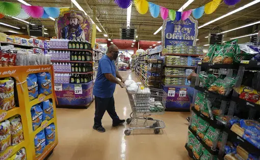 Juan Ortiz in supermarket with cart