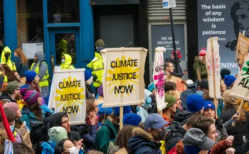 climate marchers holding signs