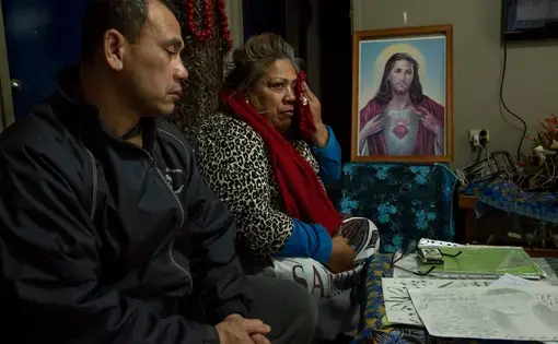 Mr. Togatuki and his wife, Atagai, with some of the items returned to them from their son’s prison cell after his suicide. Image by David Maurice Smith for The New York Times. Australia, 2018. Mr. Togatuki and his wife, Atagai, with some of the items returned to them from their son’s prison cell after his suicide. Image by David Maurice Smith for The New York Times. Australia, 2018.