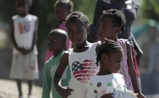 A group of children checks out visitors at the Teren Toto camp in Haiti. Image by Jose A. Iglesias. Haiti, 2019. A group of children checks out visitors at the Teren Toto camp in Haiti. Image by Jose A. Iglesias. Haiti, 2019.