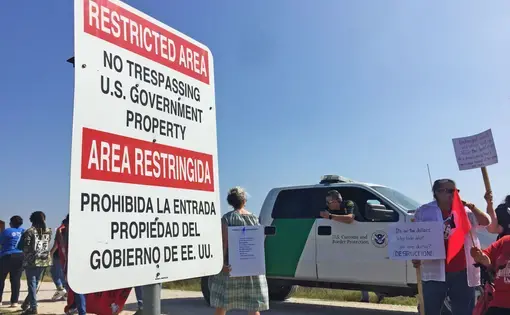 Activists march near the Lower Rio Grande Valley National Wildlife Refuge on February 16, protesting the construction of new border wall segments. Image by April Reese. USA, 2019.