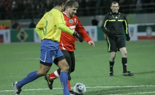 Ramzan Kadyrov (in red), the leader of Chechnya, plays in a friendly soccer match between Chechen players and a collection of Brazilian World Cup Winners in Grozny. Image: Musa Sadulayev, Russia, March 2011.