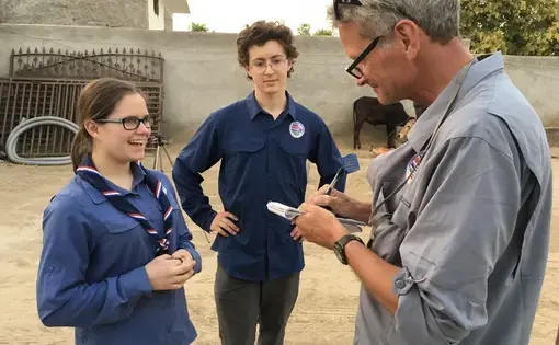 Soaking up the craft: Miciah Thacker, left, and Chris Sherman with Paul Salopek in northern India. Image by Mark Schulte. India, 2018.