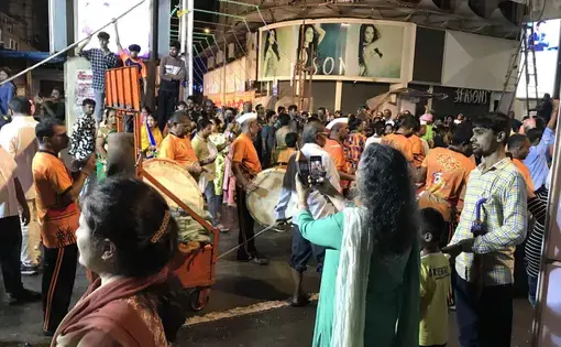 Mumbai anti-noise activist Sumaira Abdulali checks the sound levels of a procession on the final night of the 10-day Ganesh festival, when thousands of idols are led by drums and other music down to the sea for ceremonial immersion. Image by Chris Berdik. India, undated.