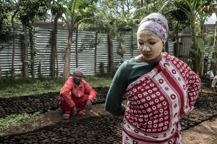 Villagers planted seedlings as part of a United Nations-funded project to restore forest cover on Anjouan. Image by Tommy Trenchard for The New York Times. Comoros, 2019.