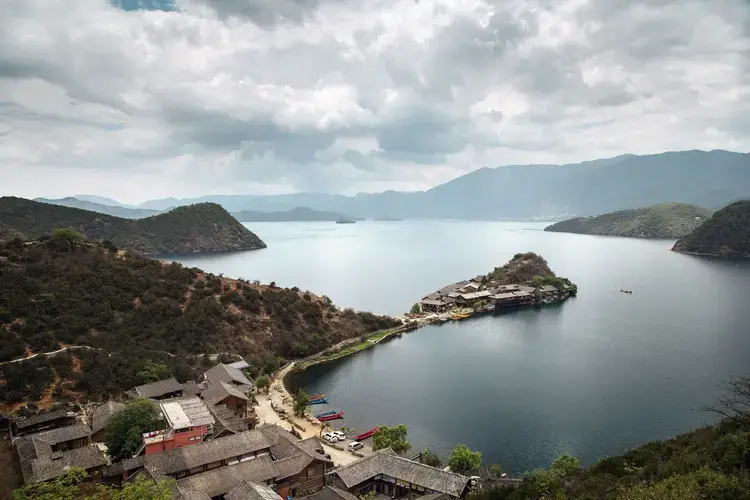 Lugu Lake, the jewel at the center of Mosuo country, straddles China’s Sichuan and Yunnan provinces. Image by Jason Motlagh. China, 2017.<br />