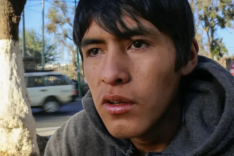 Jonathan Gutierrez, 19, said 'family problems' led him to drugs. 'I smoke cocaine, pot. I sniff glue, gasoline, everything. I get derailed. I get back on track, then I fall off again.' Image by Tracey Eaton. Bolivia, 2017.