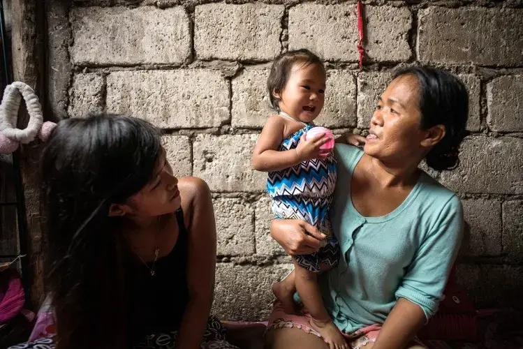 Jazmine Durana now has to depend on her parents to help support her and her daughter Hazel. Image by Martin San Diego. Philippines, 2017.