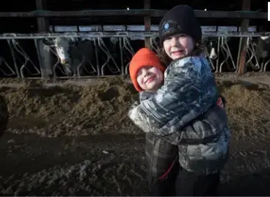 Seven-year-old Starr Thewis hugs her 4-year-old brother Skyler. Image by Mark Hoffman/Milwaukee Journal Sentinel. USA, 2019.