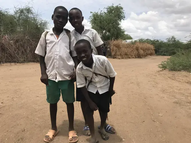 Kids at Kakuma refugee camp walk home from school. Image by Jaime Joyce. Kenya, 2018.