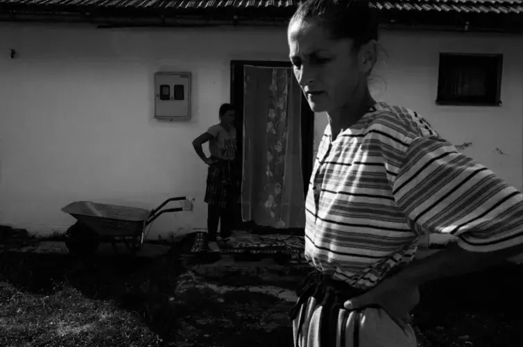 Hazira Đafič prepares to go into the woods to scavenge wood-logs, outside the Ježevac refugee camp in Banovići. Image by Jošt Franko. Bosnia and Herzegovina, undated.