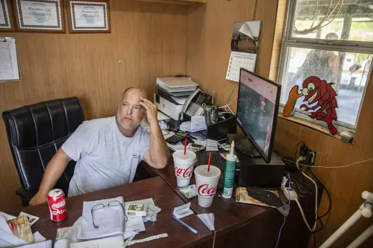 Kendall Marquar owns Pinchers, a seafood processor in Waveland. Image by Eric J. Shelton for Mississippi Today. United States, 2020.