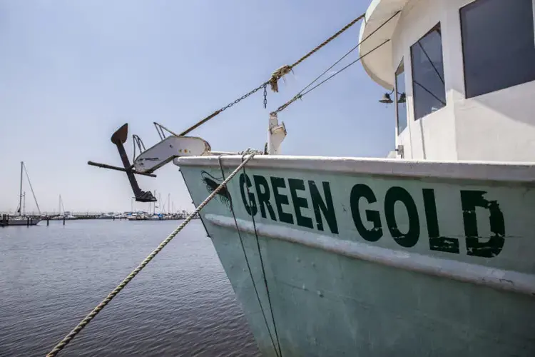 A boat at Pass Christian Harbor. Image by Eric J. Shelton for Mississippi Today. United States, 2019.