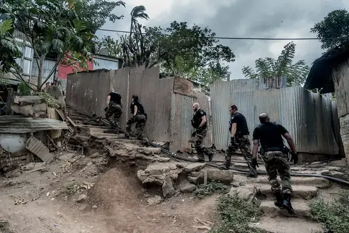 Gendarme Nationale officers on patrol in the village of Majicavo Koropa, Mayotte. Image by Tommy Trenchard. Comoros, 2019.