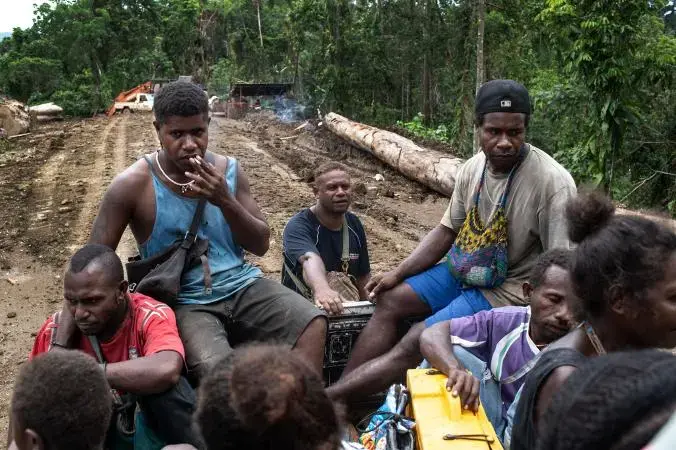 Locals who work for a different logging company than Gallego are transported up the mountain to the camp. Image by Monique Jaques. Solomon Islands, 2020.