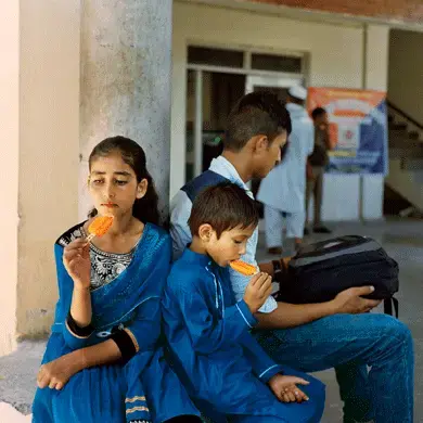 Children waiting for the train at the Baramulla station. Image by Sara Hylton. Kashmir, 2017.<br />