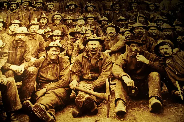 An image of early miners in Ely, who worked by candlelight and braved cave-ins to extract iron ore deep underground, is on display at the Ely Winton Historical Society. Image Courtesy of Ely Winton Historical Society.<br />
