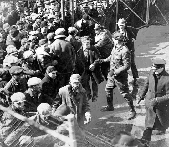 A crowd of several hundred milk strike pickets are shown in 1933 crashing the gate of the Electric Co. freight yard in Waukesha with the intention of dumping a trainload of milk headed to Milwaukee. Officials called in the Waukesha Fire Department to control the crowd with water hoses. Image courtesy of the Milwaukee Journal Sentinel archives.