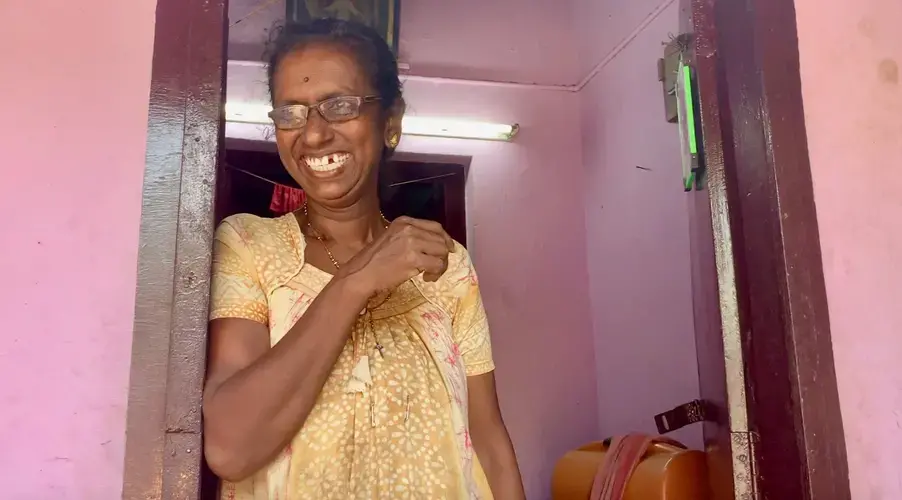 Marykutty stands in her home in the Chathanad Colony. Image by Katelyn Weisbrod. India, 2019.