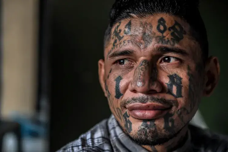 A born-again member of the 18th Street gang now living in the Eben Ezer evangelical church. Image by Neil Brandvold. El Salvador, 2018.