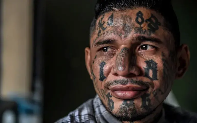 A born-again member of the 18th Street gang now living in the Eben Ezer evangelical church. Image by Danny Gold. El Salvador, 2018.