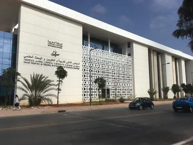 A new white government building with mosaic decor. 