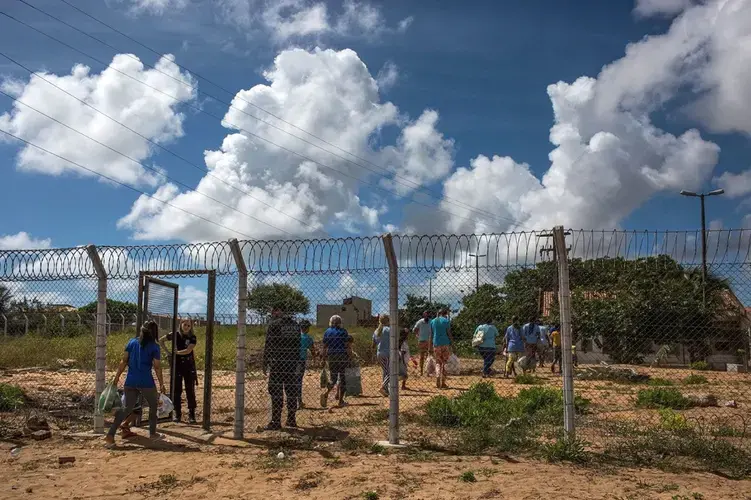 Visitors enter the Alcaçuz in 2018, less than a year after the riot. Image by Lianne Milton. Brazil, 2018.