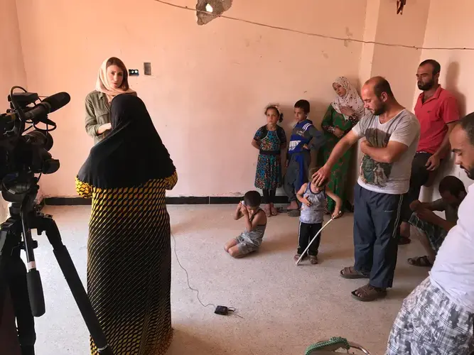 The Khalil family lost their home in Raqqa to air strikes and ISIS attacks. Now they try to get by in a bombed-out building that is barely inhabitable. Still, they push forward. Image by Jon Gerberg/PBS NewsHour. Syria, 2017.