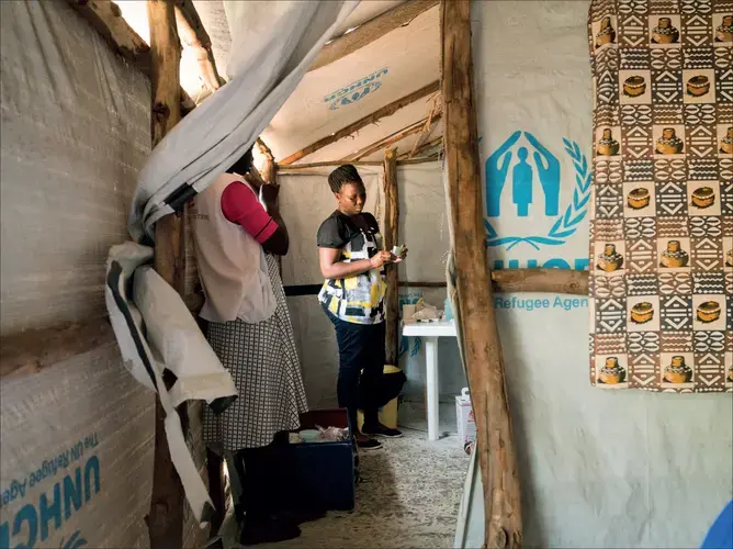 Susan Oyera, a midwife at the Médecins Sans Frontières sexual violence and mental health clinic in the Omugo settlement in the Rhino camp extension gives emergency contraception to a patient who was raped in the Omugo settlement for refugees after she had fled from South Sudan to Uganda.