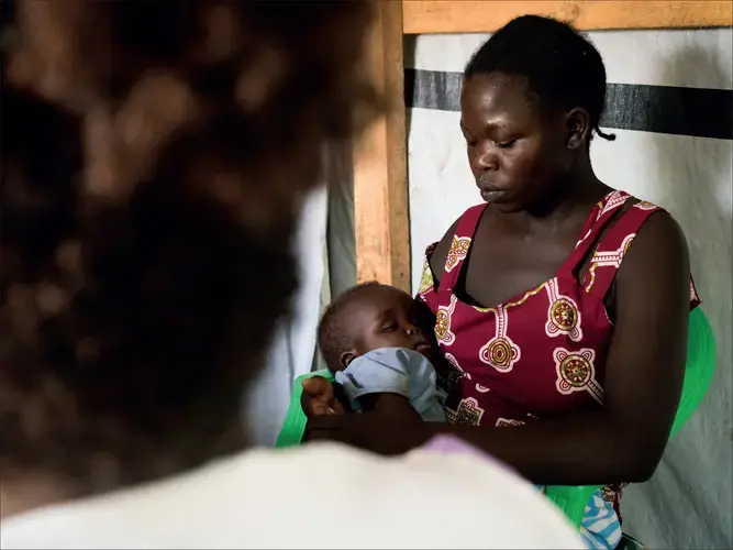 A woman who arrived in Uganda a few months ago sits with her son and speaks to midwife Susan Oyera in the Médecins Sans Frontières sexual violence and mental health clinic in the Omugo settlement in the Rhino camp extension in Uganda for refugees from South Sudan. Susan explained the reason for the tests: “We don't know the status and the health history of the person who assaulted you.'