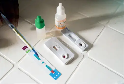 Susan Stima has three separate HIV tests that all turn positive. Image by Adriane Ohanesian. Uganda, 2019.
