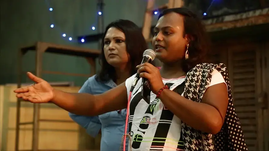 Sintu worked with members of Anandam to organize a queer cafe open to all. As secretary of Anandam, she introduced the event and the evening's performers. Image by Siyona Ravi. India, 2017.
