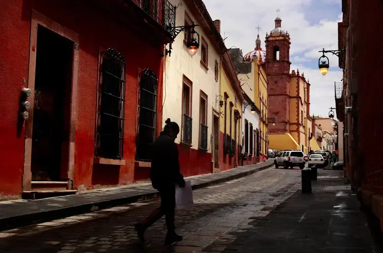 A pedestrian walks through Zacatecas. Image by Erika Schultz. Mexico, 2019.
