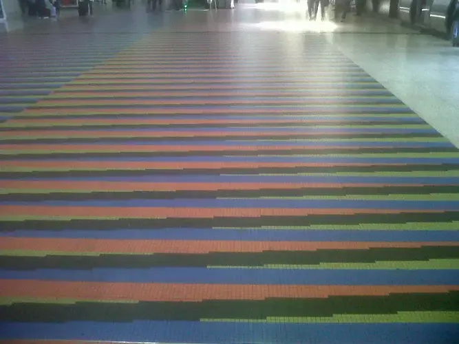 Floor of Couleur Additive in Venzeula's Simón Bolívar International Airportby artist Carlos Cruz-Diez. Image by Lila Franco. Venezuela, 2017.