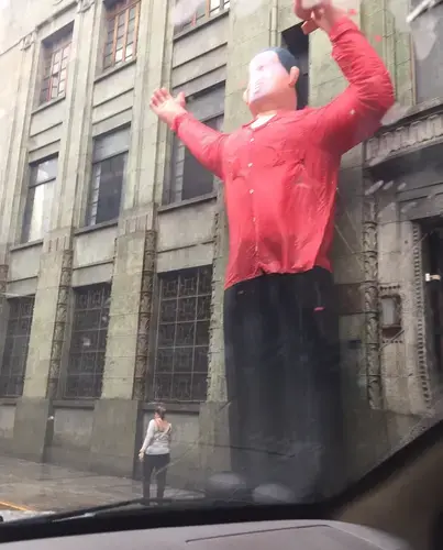 Inflatable figure of Hugo Chávez outside a building in the city's downtown area. Image by Fernando Gago. Venezuela, 2017.