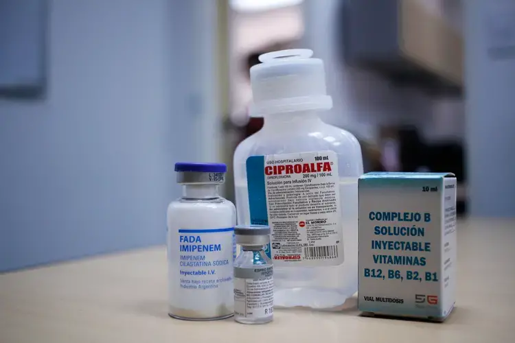 A display of Carlos Román's medication. Patients in dialysis must carefully follow their treatment, but severe medicine shortages that have affected the country in recent years have made it harder. Patients often must look through several drugstores, resort to social media, or swap medicine for food and other goods. Some even find themselves forced to take expired medication. A solution of vitamin B complex (right) that Roman takes for his treatment expired in May 2018, but he continued to use it through…