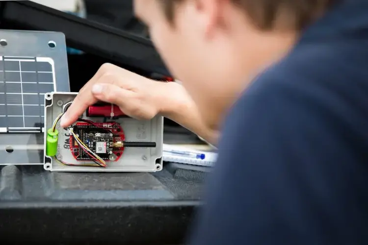 A close-up of a sensor being installed for Cambodia's EWS1294 flood detection system.  Data from these sensors is now being used to create AI capability for potentially detecting 'false positive' alarms, and predicting flood risk. Image by Nickie Mariager-Lam for People In Need. Cambodia, 2018.