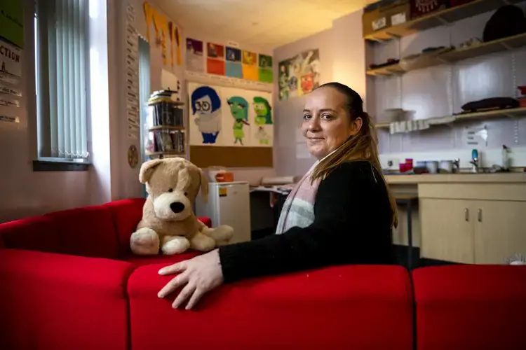 Natalie Muir sits in the Nurture Room at Clydebank High School in Clydebank, West Dunbartonshire. Natalie is a single mother with a 16-year-old daughter and a 5-year-old son. Image by Michael Santiago. Scotland, 2019.