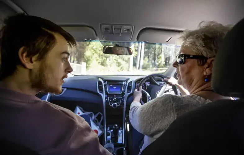 Deb Ware, right, drives her son, Sam, back to her home for the first time since she last found him overdosing there three weeks earlier in Fountaindale, Central Coast, Australia, Friday, July 19, 2019. Image courtesy of David Goldman. Australia, 2019.