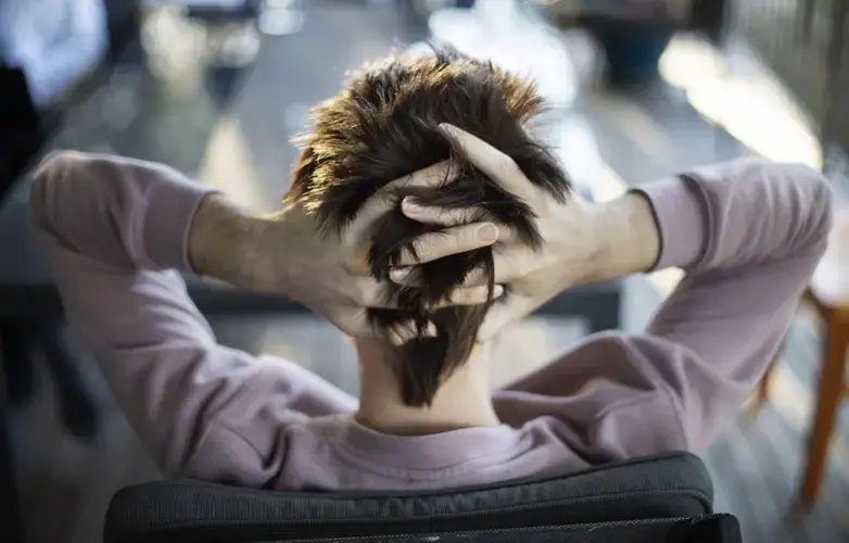Sam Ware runs his fingers through his hair while listening to his mother urge him to go to rehab, in Fountaindale, Central Coast, Australia, Friday, July 19, 2019. Image courtesy of David Goldman. Australia, 2019.