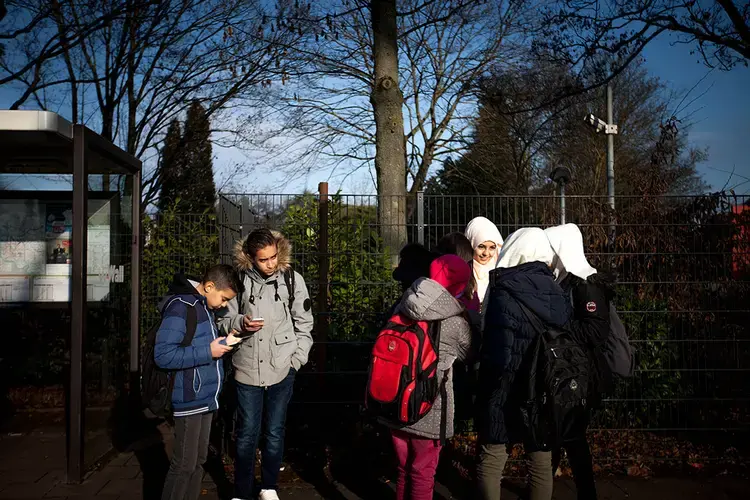 Milad is adapting to school in Dusseldorf. It takes him an hour to get there by bus and train. Image by Diana Markosian. Germany, 2017.